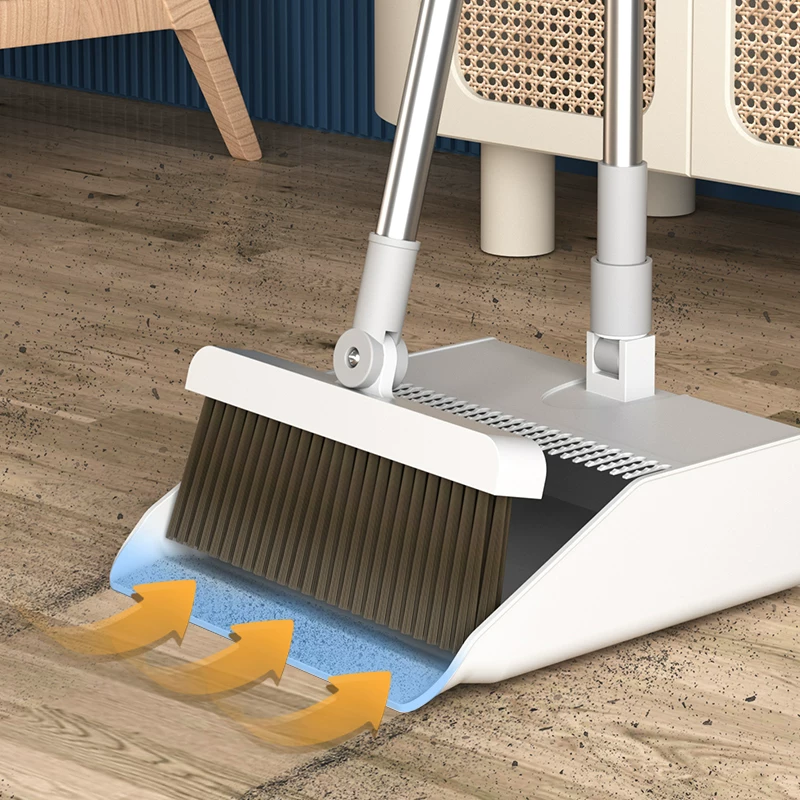 Close up of soft bristle broom sweeping dust and debris from SPC vinyl plank flooring surface before damp mopping showing proper dry cleaning step that prevents micro scratches during maintenance